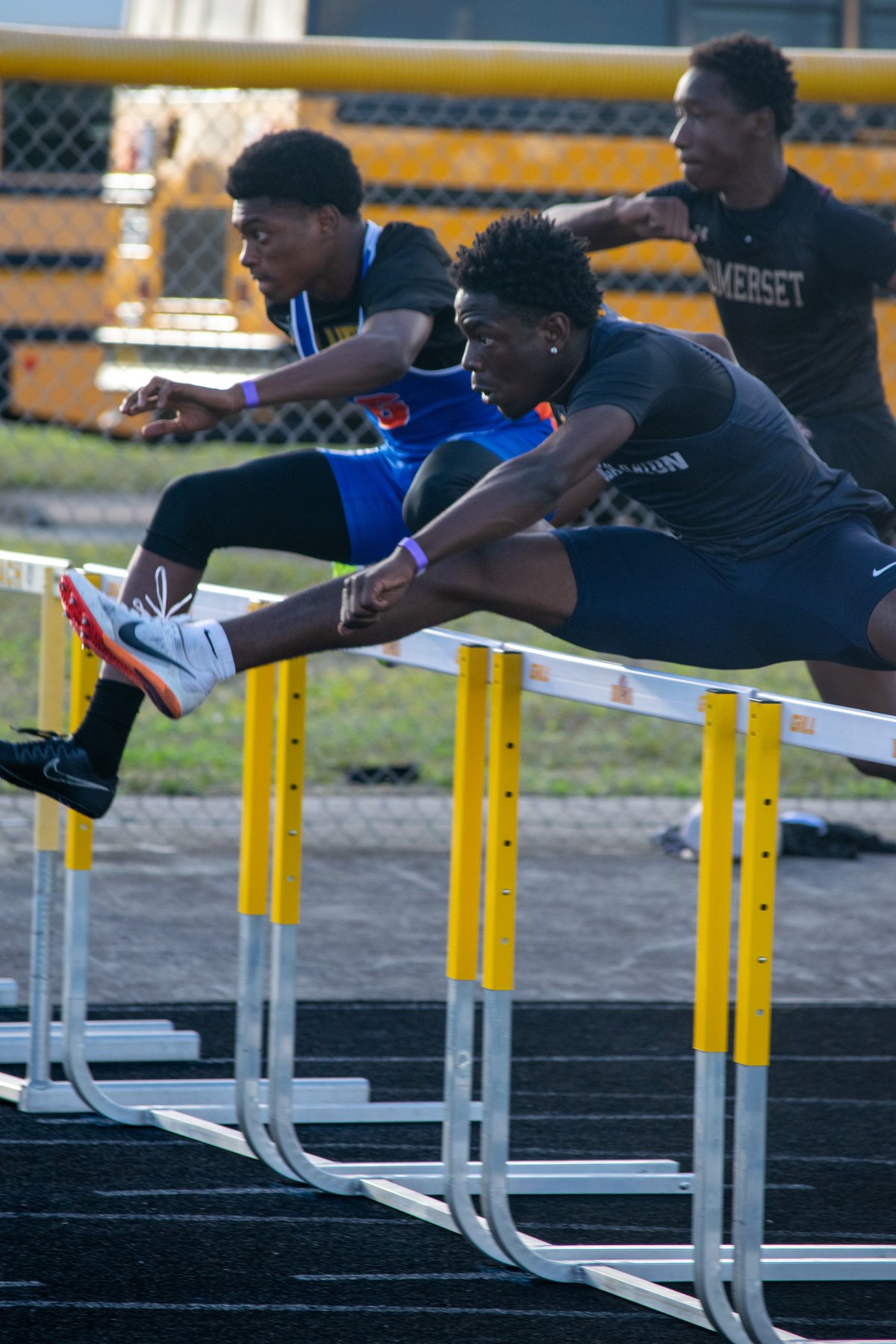 Tristan Sejour competing in hurdles for Boca Raton High School